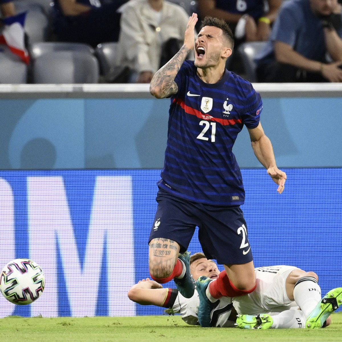 Germany's Joshua Kimmich, back, challenges France's Lucas Hernandez during the Euro 2020 soccer championship group F match between Germany and France at the Allianz Arena stadium in Munich,  ...