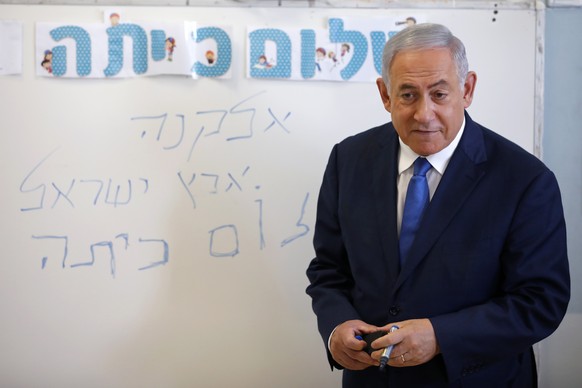 Israeli Prime Minister Benjamin Netanyahu speaks to students during a ceremony opening the new school year, Sunday, Sept. 1, 2019, in the West Bank Israeli settlement of Elkana. Speaking Sunday at the ...