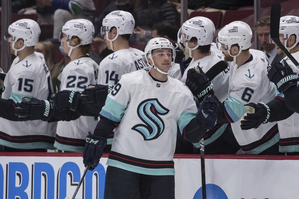 Seattle Kraken's Vince Dunn (29) celebrates his first goal against the Vancouver Canucks during the second period of an NHL preseason hockey game, Tuesday, Oct. 5, 2021 in Vancouver, British Colu ...