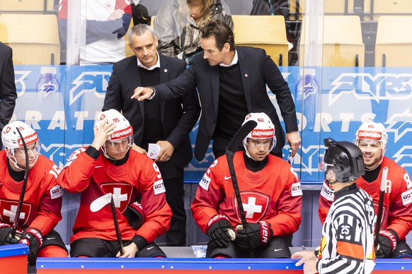 Patrick Fischer, right, head coach of Switzerland national ice hockey team, gestures next to Jan Cadieux Jan, left, assistant coach of Switzerland national ice hockey team, during the IIHF 2025 World  ...