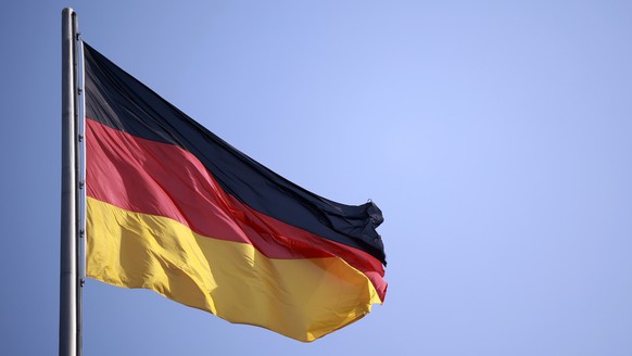 epa11986632 The German flag flutters before the constituent session of the German parliament &#039;Bundestag&#039; in Berlin, Germany, 25 March 2025. The 21st German Bundestag will hold its first, con ...