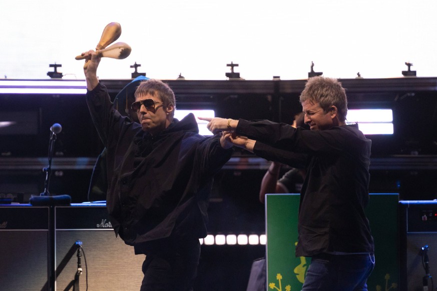 November 7, 2025, Sydney, New South Wales, Australia: SYDNEY, AUSTRALIA - NOVEMBER 07 2025: Liam and Noel Gallagher of British band Oasis walk together on stage to perform as part of their Live 25 glo ...