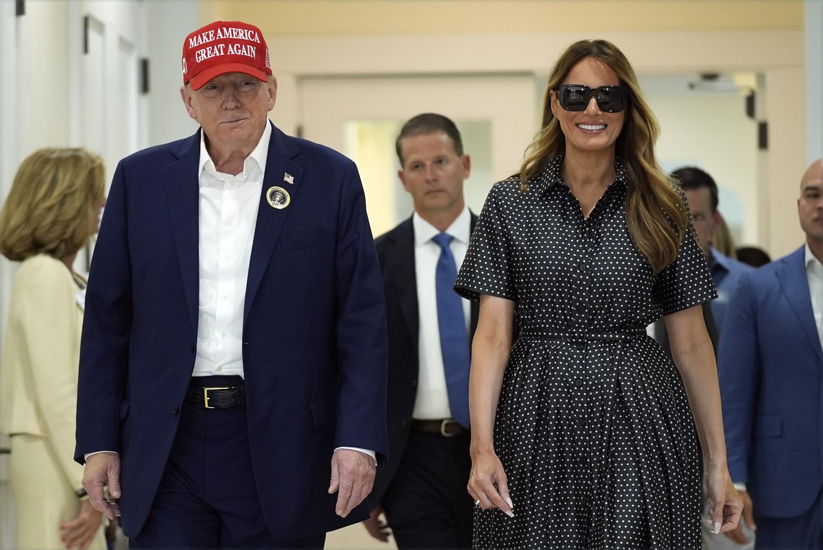 Republican presidential nominee former President Donald Trump and former first lady Melania Trump walk after voting on Election Day at the Morton and Barbara Mandel Recreation Center, Tuesday, Nov. 5, ...