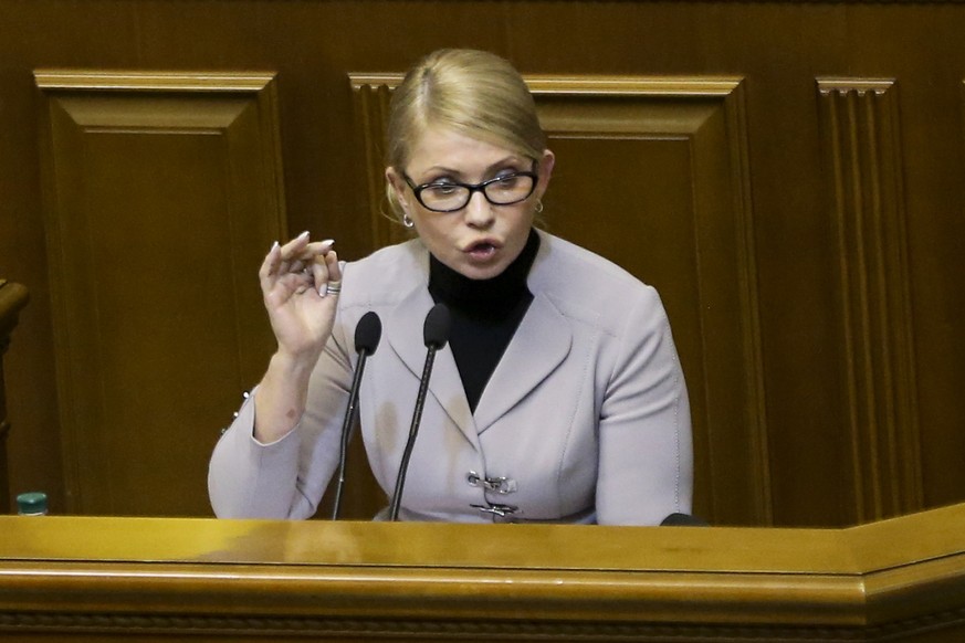 Ukrainian opposition leader Yulia Tymoshenko gestures during a parliament session in Kiev, Ukraine, Monday, Nov. 26, 2018. Ukrainian President Petro Poroshenko has halved his proposal for martial law  ...