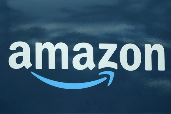 FILE - An Amazon logo appears on a delivery van, Oct. 1, 2020, in Boston. A state agency in New York has filed an administrative complaint against Amazon, Wednesday, May 18, 2022, alleging the e-comme ...