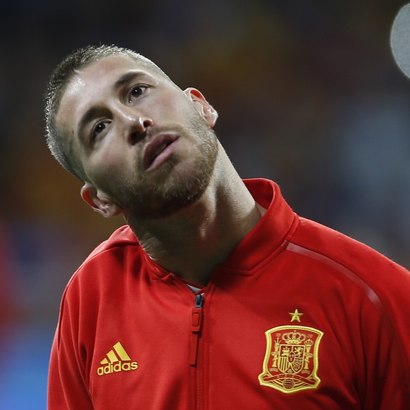 FILE - In this March 27, 2018 file photo, Spain's Sergio Ramos listens to the national anthem before the international friendly soccer match between Spain and Argentina at the Wanda Metropolitano ...