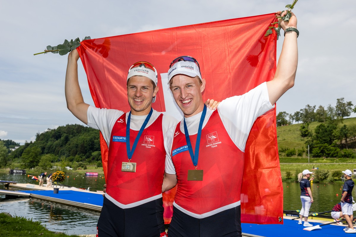 Bronze medalists Roman Roeoesli, left, and Andrin Gulich of Switzerland celebrate the third place in the Men's Pair Final A on the third day of the 2024 World Rowing Cup at Rotsee on Sunday, May  ...