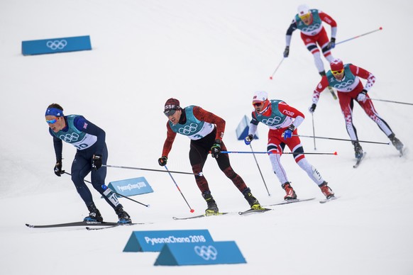 Dario Cologna of Switzerland, 2nd left, in action during the men Cross Country Skiing 15 km + 15 km Skiathlon during the XXIII Winter Olympics 2018 at the Alpensia Cross-Country Skiing Centre in Pyeon ...