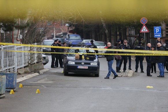 epa06443094 Police investigators search the crime scene for evidence, where Oliver Ivanovic, the former State Secretary for Kosovo and Metohija and a subject of a controversial war crimes trial and re ...