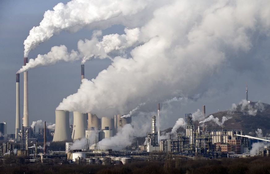 FILE - In this Dec. 16, 2009 file photo, steam and smoke rise from a coal burning power plant in Gelsenkirchen, Germany. The state governors Dietmar Woidke of Brandenburg, Michael Kretschmer of Saxony ...