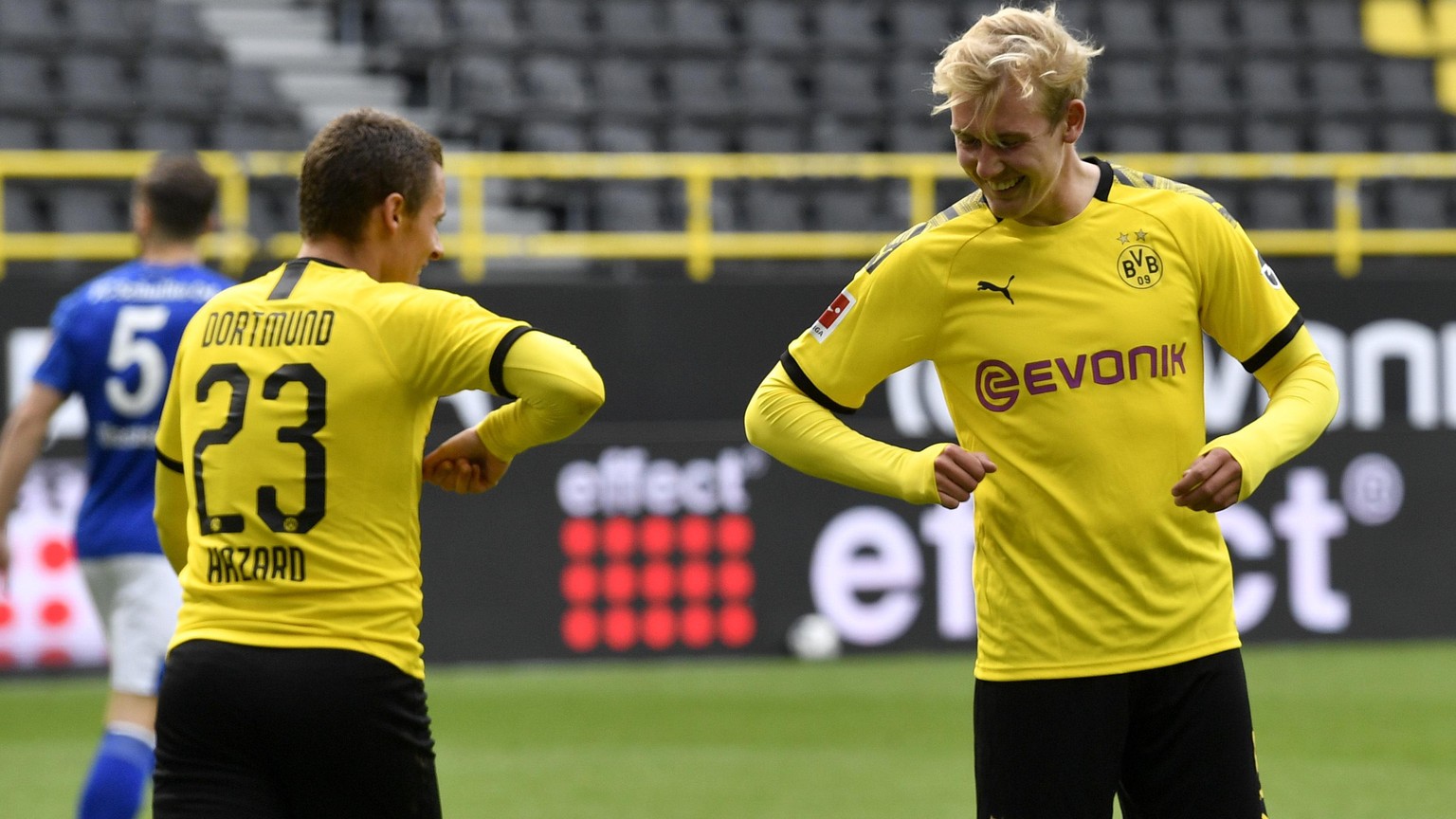 Dortmund&#039;s Thorgan Hazard, left, celebrates with Erling Haaland after scoring his side&#039;s third goal during the German Bundesliga soccer match between Borussia Dortmund and Schalke 04 in Dort ...