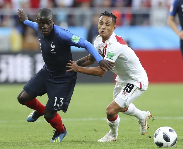 France&#039;s Ngolo Kante, left vies for the ball with Peru&#039;s Yoshimar Yotun during the group C match between France and Peru at the 2018 soccer World Cup in the Yekaterinburg Arena in Yekaterinb ...