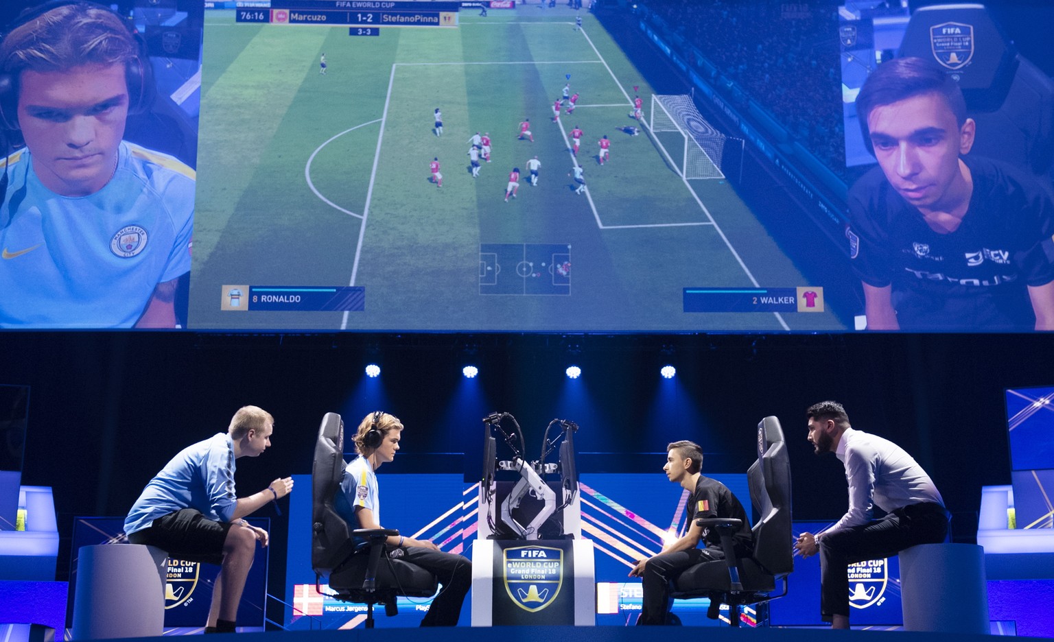 epa06927134 Stefano &#039;Pinna&#039; Pinna of Belgium competes against Marcus &#039;Marcuzo&#039; Jorgensen of Denmark in the Semi Final of the FIFA eWorld Cup 2018 at the O2 Arena in London, Britain ...