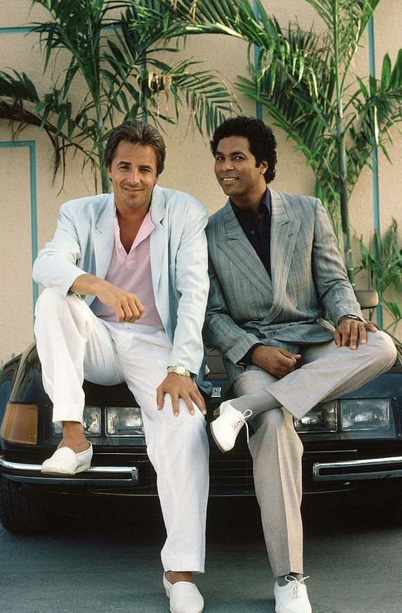 MIAMI VICE -- Season 2 -- Pictured: (l-r) Don Johnson as Det. James 'Sonny' Crockett, Philip Michael Thomas as Det. Ricardo 'Rico' Tubbs (Photo by Frank Carroll/NBCU Photo Bank/NBC ...