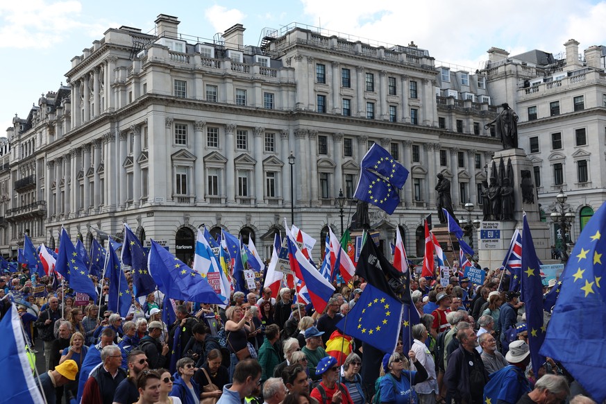 epa10878527 European Union flags are held aloft as people participate in the &#039;Rejoin&#039; march in central London, Britain, 23 September 2023. This was the second national rejoin march calling f ...