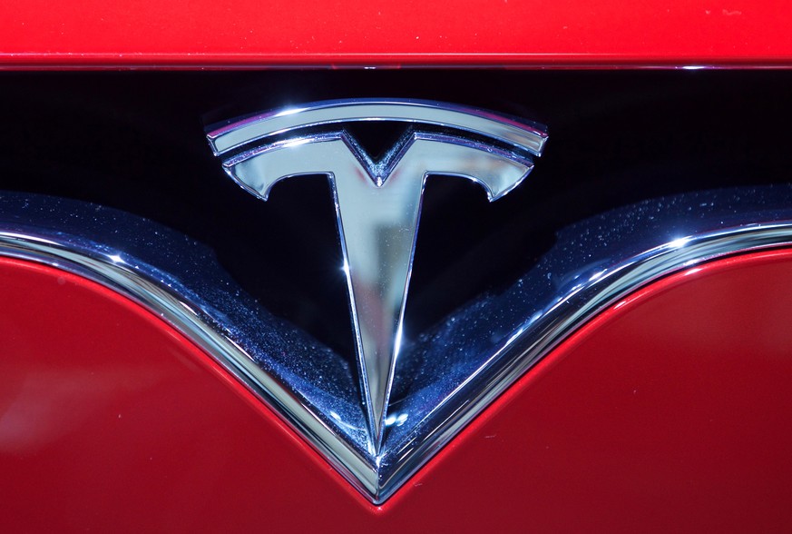 epa08967903 (FILE) - A Tesla logo seen at the Paris Motor Show &#039;Mondial de l&#039;Automobile&#039; in Paris, France, 30 September 2016 (reissued 26 January 2021). Tesla is to publish their 4th qu ...