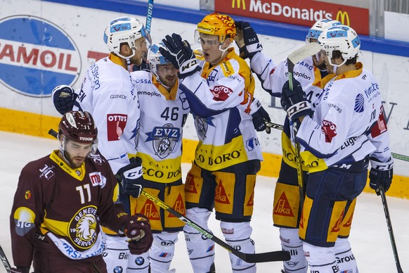 Zug&#039;s forward Lino Martschini #46 celebrates his goal with teammates defender Jesse Zgraggen, 2nd left, forward Gregory Hofmann, 3rd right, center Jan Kovar #43, of Czech Republic, and defender M ...