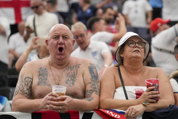 Soccer fans wait for a Group C match between Denmark and England at the Euro 2024 soccer tournament in Frankfurt, Germany, Thursday, June 20, 2024. (AP Photo/Thanassis Stavrakis)