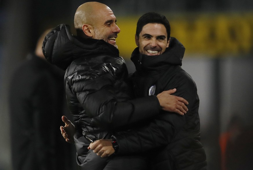 Josep Guardiola manager of Manchester City celebrates with assistant Mikel Arteta during the Premier League match at Turf Moor, Burnley. Picture date: 3rd December 2019. Picture credit should read: Si ...