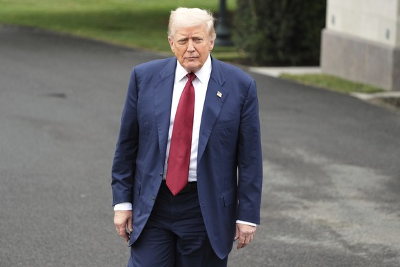 President Donald Trump walks to speak with reporters before departing the White House en route to Joint Base Andrews, Md., Friday, Aug. 1, 2025, in Washington. (AP Photo/Jacquelyn Martin)
Donald Trump