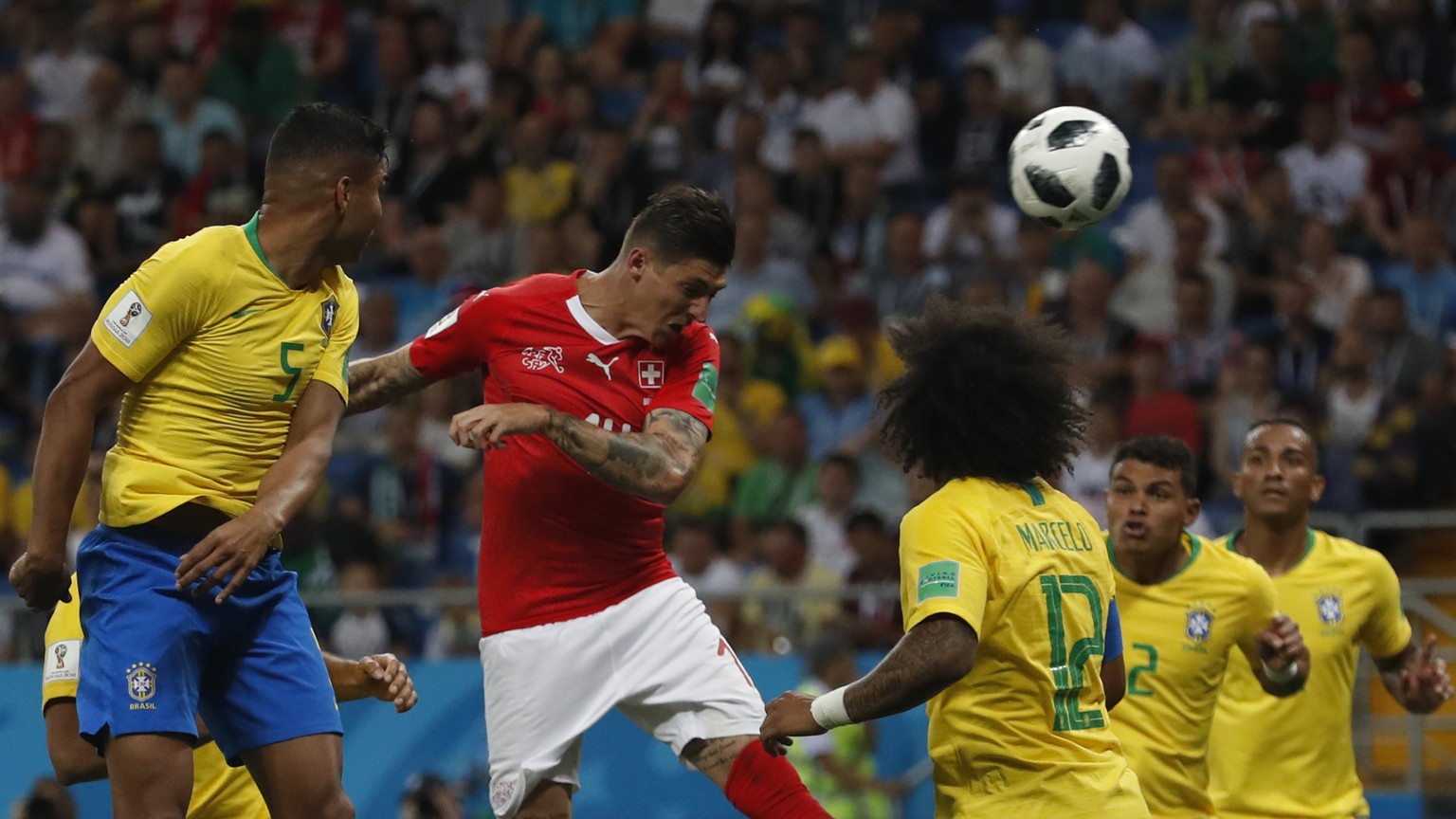 Switzerland&#039;s Steven Zuber, center, heads for the ball to score during the group E match between Brazil and Switzerland at the 2018 soccer World Cup in the Rostov Arena in Rostov-on-Don, Russia,  ...