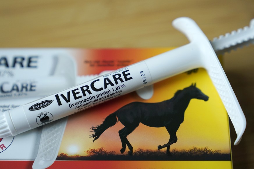 FILE - In this Sept. 10, 2021, file photo, a syringe of of ivermectin �?? a drug used to kill worms and other parasites �?? intended for use in horses only, rests on the box it was packaged in, in Oly ...