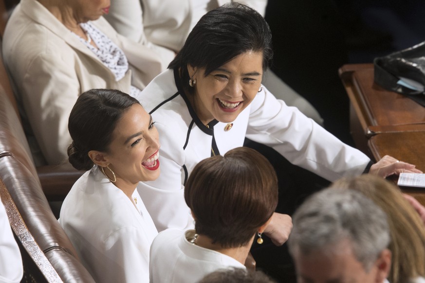 epa07346827 Democratic Representative from California Judy Chu (top) and Democratic Representative from New York Alexandria Ocasio-Cortez (L) attend the second State of the Union address of US Preside ...