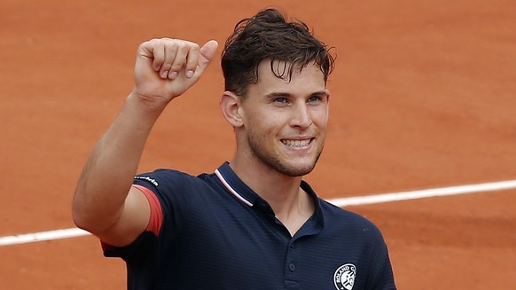 Austria&#039;s Dominic Thiem thumbs up after defeating Germany&#039;s Alexander Zverev hug after their quarterfinal match of the French Open tennis tournament at the Roland Garros stadium, Tuesday, Ju ...
