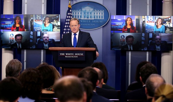 Press Secretary Sean Spicer speaks as television screen displays journalists who participate in the daily briefing via Skype at the White House in Washington U.S., February 1, 2017. REUTERS/Carlos Bar ...