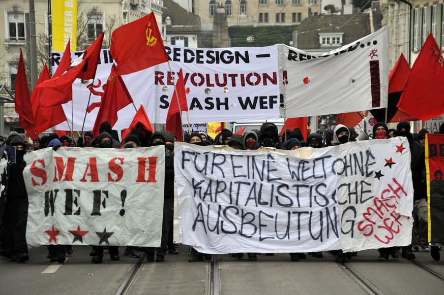 Protesters march through the streets of Basel, Switzerland, during a demonstration against the World Economic Forum, WEF, on Saturday, January 30, 2010. (KEYSTONE/Georgios Kefalas)