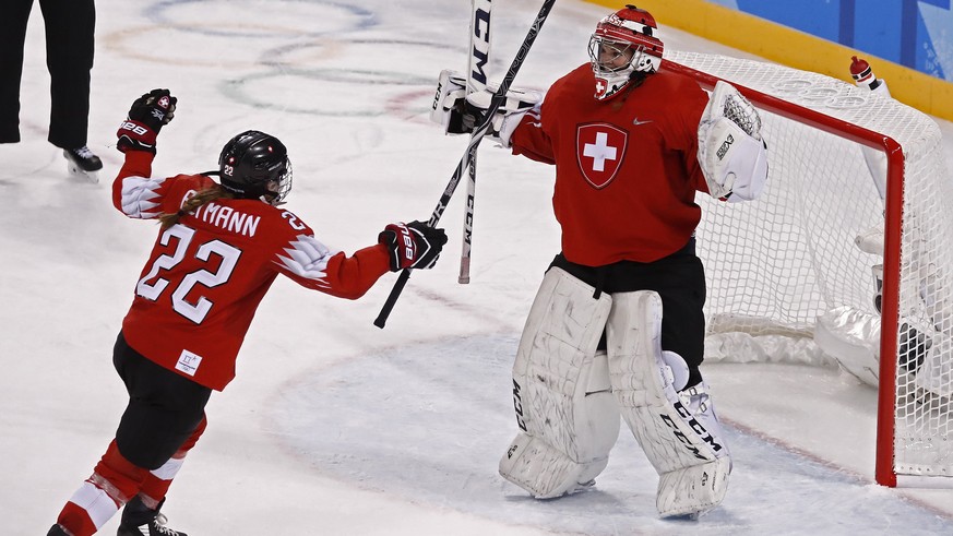 epa06517256 Livia Altmann (L) of Switzerland jumps into the arms of goalie Florence Schelling (R) after win against Japan inside the Kwandong Hockey Centre at the PyeongChang Winter Olympic Games 2018 ...