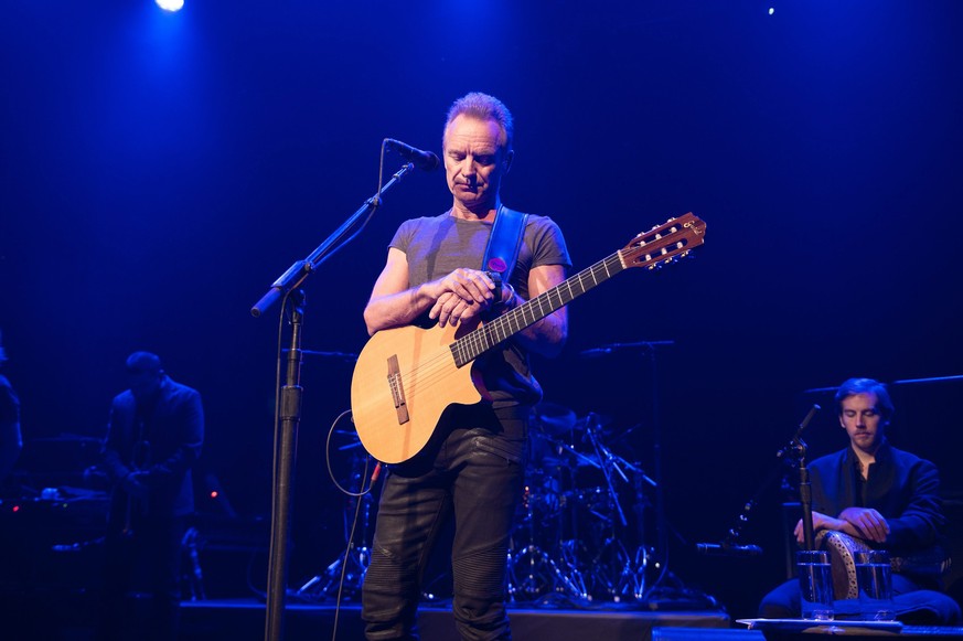 epa05629050 A handout image provided by the Bataclan managment shows British musician Sting (C) during his concert at the newly reopened Bataclan concert venue in Paris, France, 12 November 2016. The  ...