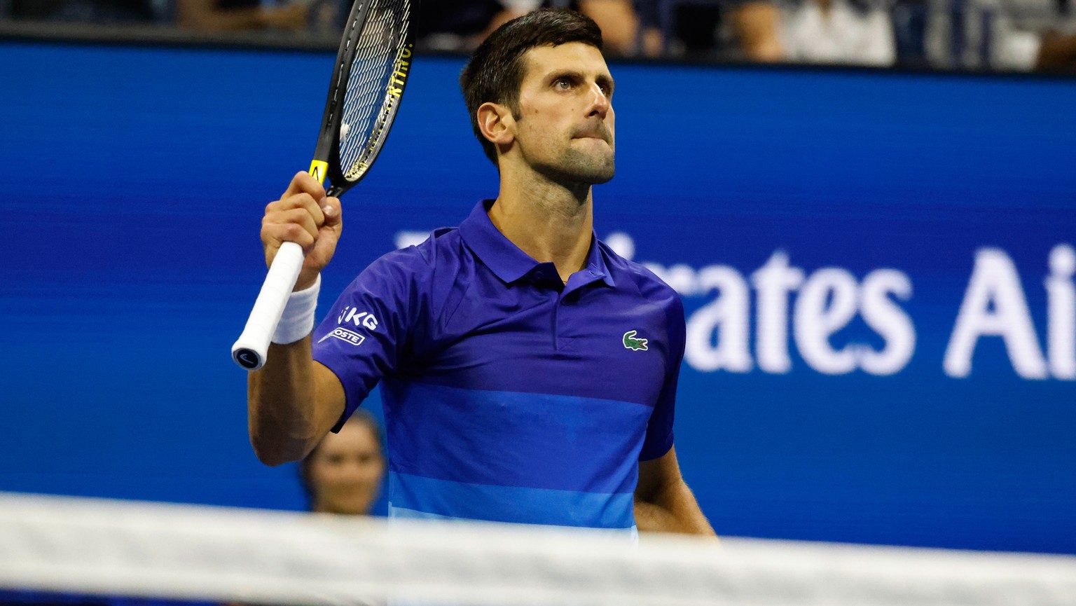 epa09444440 Novak Djokovic of Serbia gestures to the crowd after defeating Tallon Greikspoor of Netherlands during their match on the fourth day of the US Open Tennis Championships at the USTA Nationa ...