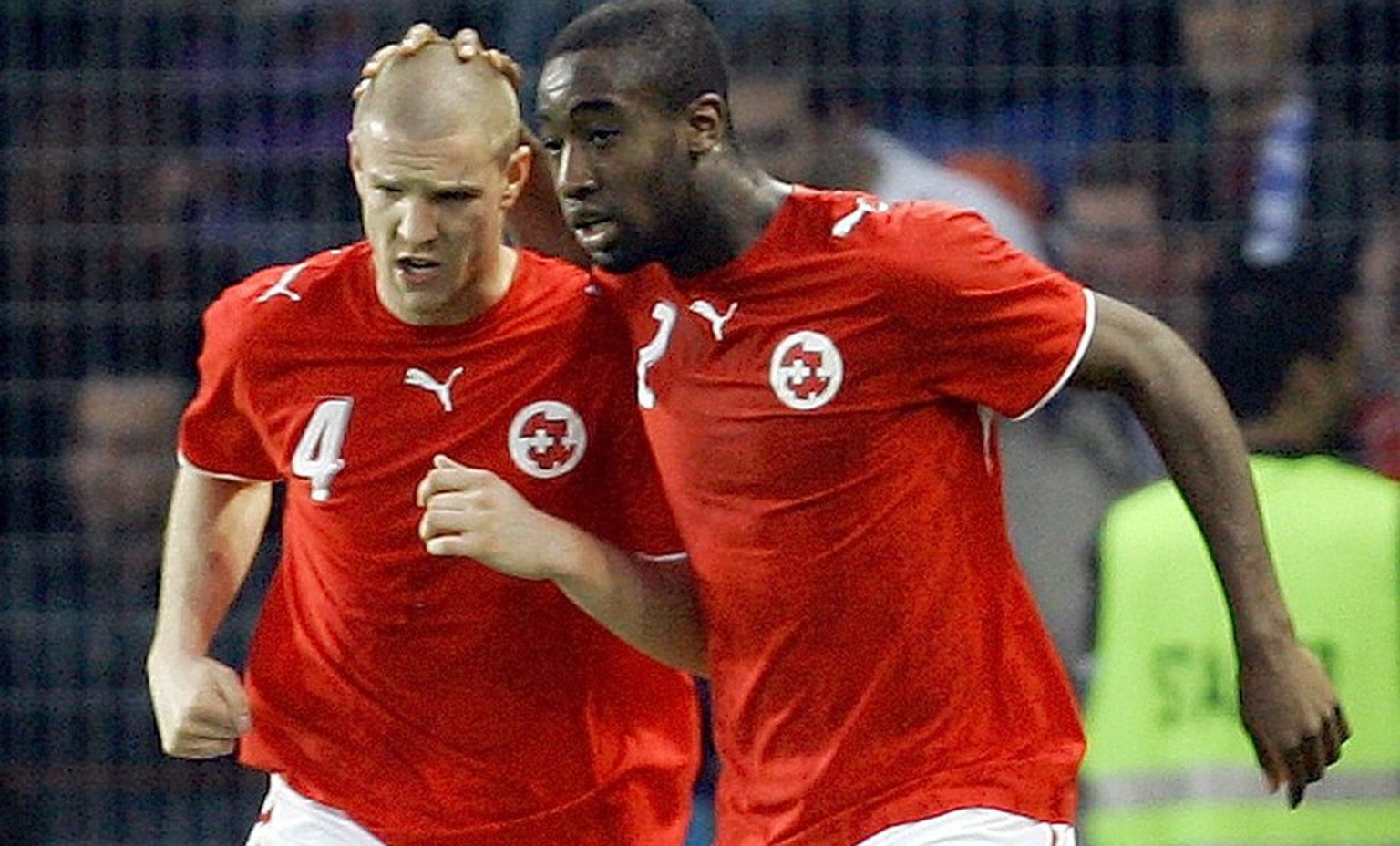 Switzerland&#039;s Philippe Senderos, left, celebrates with Johan Djourou, right, Italy&#039;s after Switzerland scored during a friendly soccer match in preparation for the upcoming Soccer World Cup  ...