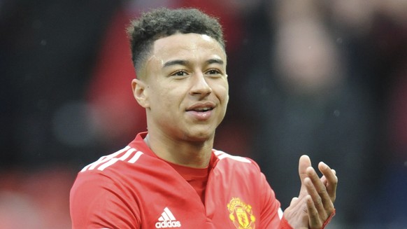 Manchester United&#039;s Jesse Lingard applauds the fans as he walks from the pitch after the end of the English Premier League soccer match between Manchester United and Liverpool at Old Trafford in  ...