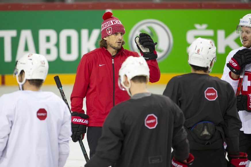 Patrick Fischer, head coach of Switzerland national ice hockey team, instructs his players during a training session, at the IIHF 2021 World Championship quarter final game between Switzerland and Ger ...