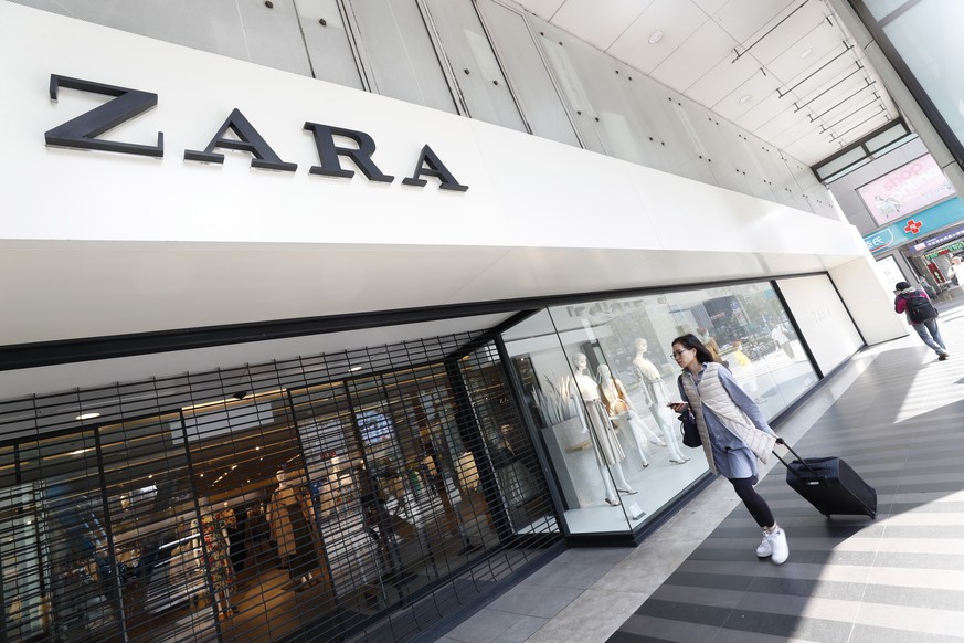 epa07446225 A woman walks past Zara, a Spanish fast fashion retailer store in Taipei, Taiwan, 13 March 2019 (issued 18 March 2019). Spain started its pork import to Taiwan in 2014 and has since become ...