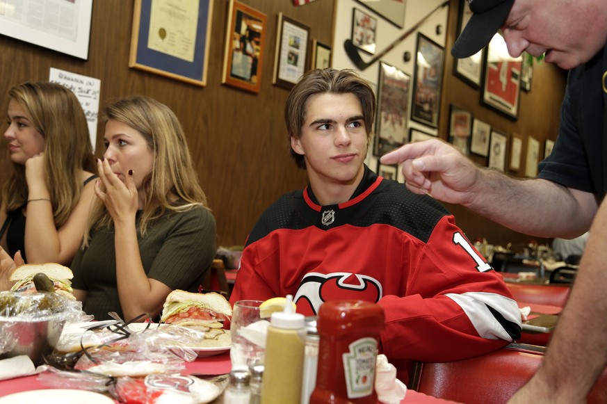 New Jersey Devils&#039; Nico Hischier talks with an owner of Hobby&#039;s Deli, Marc Brummer, in Newark, N.J., Monday, June 26, 2017. The 18-year-old center was the first Swiss-born player to be draft ...