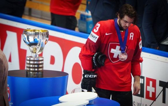 Nico Hirschier Nr. 13 of Switzerland sad beside the trophy after the Gold Medal game CZECHIA - SWITZERLAND 2-0 of the IIHF Ice hockey, Eishockey World Championship, WM, Weltmeisterschaft in Prague, Cz ...
