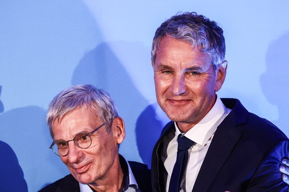 epa11619512 Top candidate of far-right party Alternative for Germany (AfD) for the regional elections in Brandenburg, Hans-Christoph Berndt (L) and the AfD party leader in Thuringia Bjoern Hoecke hug  ...