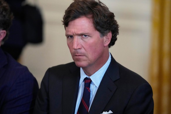 FILE - Tucker Carlson attends a meeting with President Donald Trump and oil executives in the East Room of the White House, Jan. 9, 2026, in Washington. (AP Photo/Alex Brandon, File)
Donald Trump