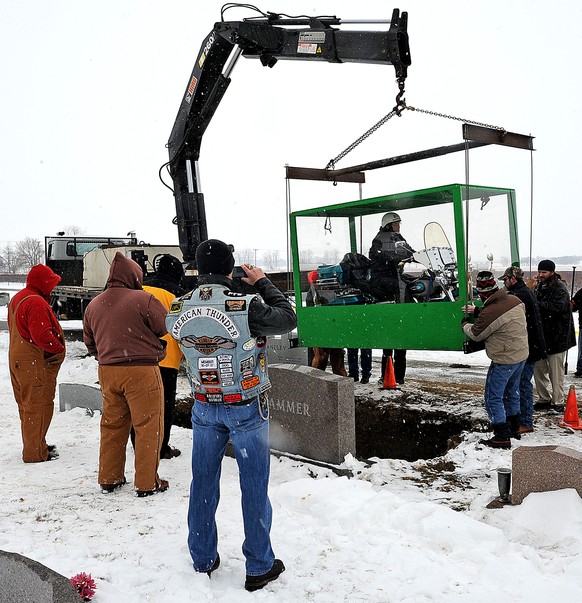 The family of Billy Standley, of Mechanicsburg, Ohio, carried out his wish to be buried on his 1967 Harley Davidson motorcycle Friday, Jan. 31, 2014, burying him in a large Plexiglas casket at Fairvie ...