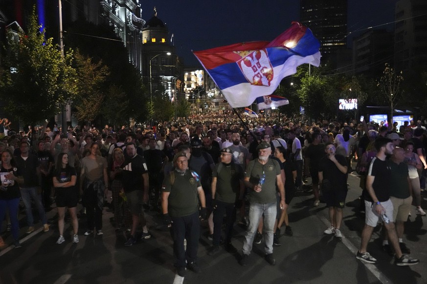 Anti-government protesters march during an protest near Serbian Progressive Party office in Belgrade, Serbia, Thursday, Aug. 14, 2025. (AP Photo/Darko Vojinovic)