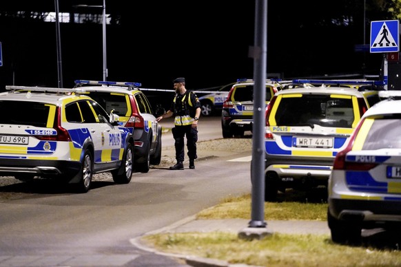 epa09314776 Police at the scene where a fellow police officer was shoot dead during a shooting in Gothenburg, Sweden, 01 July 2021. EPA/Bjorn Larsson Rosvall SWEDEN OUT