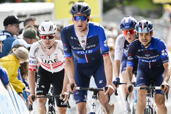 Marc Hirschi from Switzerland of UAE, right, and Stefan Kueng from Switzerland of Groupama-FDJ, at the finish line after the seventh stage, a 118.1 km race in Villars-Sur-Ollon, at the 87th Tour de Su ...
