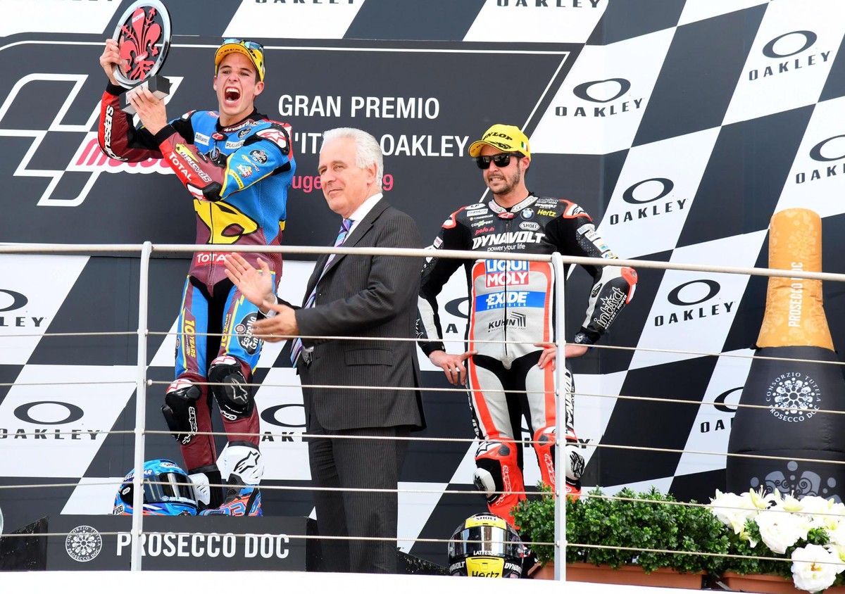 epa07619967 Second placed Italian Moto2 rider Luca Marini (L) of SKY Racing Team VR46, winner Spanish Moto2 rider Alex Marquez (C2-L) of EG 0,0 Marc VDS and third placed Swiss Moto2 rider Thomas Lueth ...