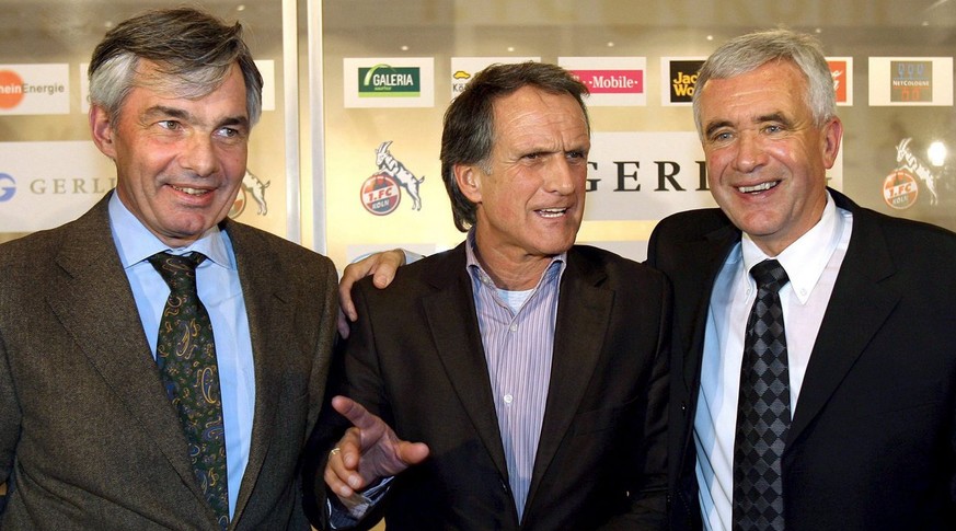 The manager of Bundesliga soccer club 1st FC Cologne Michael Meier (L) and Cologne&#039;s president Wolfgang Overath (C) introduce Hanspeter Latour (R), the new coach of the club during a public intro ...