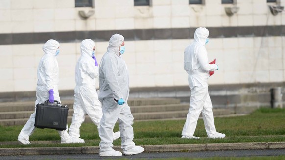 epaselect epa10485172 Forensic Investigators from the Police of Northern Ireland (PSNI) work at the scene of a shooting at a sports complex in Omagh, County Tyrone, Northern Ireland, UK, ...