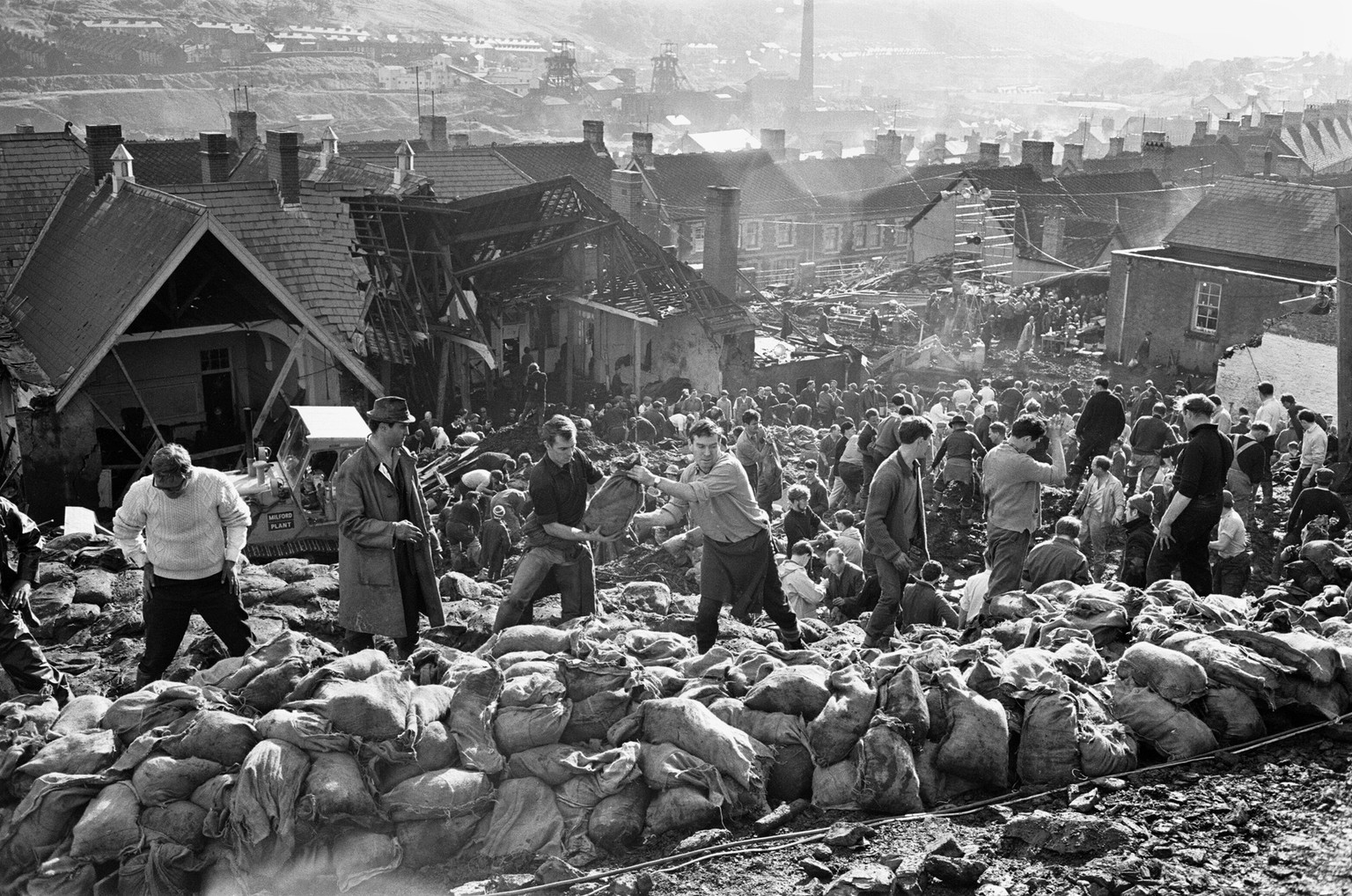 Rescue workers bagging and moving some of the coal spoil following the catastrophic collapse of a colliery spoil tip in the Welsh village of Aberfan, near Merthyr Tydfil, on 21 October 1966. The resul ...