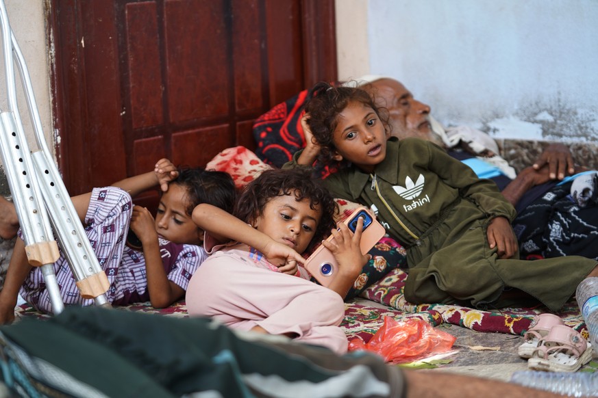Displaced Yemenis rest at a temporary shelter in the Dar Saad district of Aden, Yemen, Saturday, Sept. 12, 2026, after fleeing Houthi attacks in the western coastal cities of al-Khokha and Mokha. (AP  ...